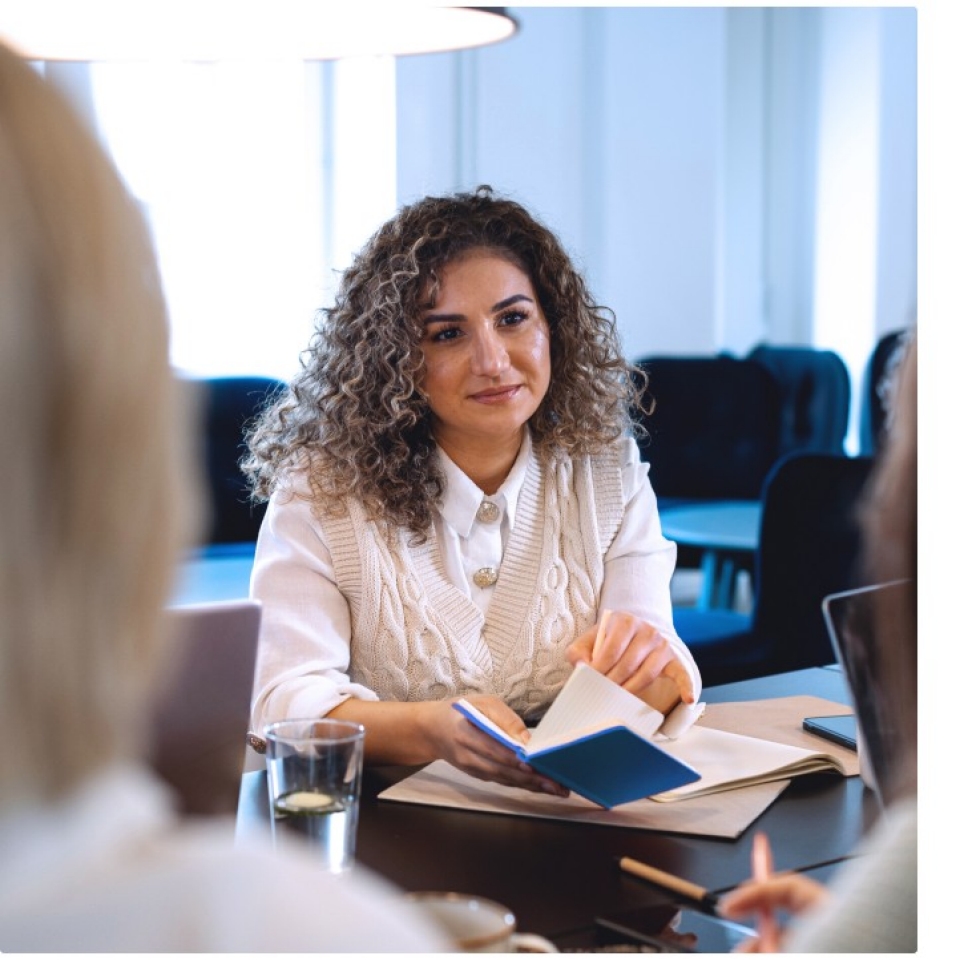 Women talking at desk