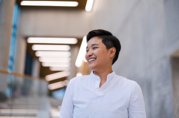 Young man standing in front of building