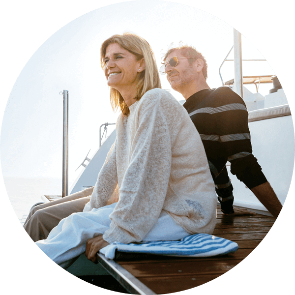 Smiling couple on a yacht deck